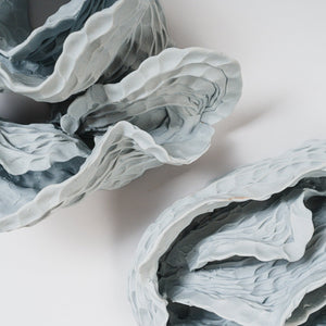 Sam Gold, A Thirst (detail), 2023, porcelain and blue oxide, 18 x 140 cm irreg. Photo by Connor Patterson