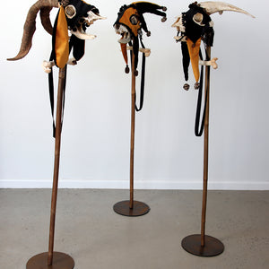 Sue Kneebone, Scapegoat I, II, II, 2026, cane, cloth, goat skull, bone, seed pods, 135 × 30 × 36 cm irreg.each