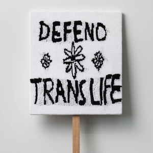 Kate Just, Defend Trans Life, 2021, knitted wool as placard with plywood stand, 56 x 50 cm
