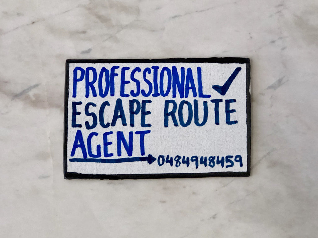 Lucas Grogan 'Professional Escape Route Agent' business card