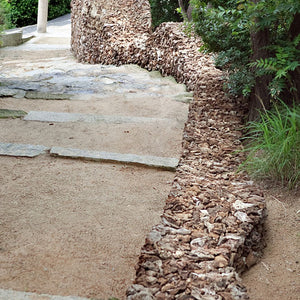 James Darling and Lesley Forwood, Wall Work 5: from Kamojima to Kamojinja, 2010, 13.5 tonnes Mallee roots, 1.9 x 24.0 x 1.7 m, at the 2010 Setouchi Trienniale (Setouchi International Art Festival), Ogijima, Seto Inland Sea, Kagawa Prefecture, Japan
