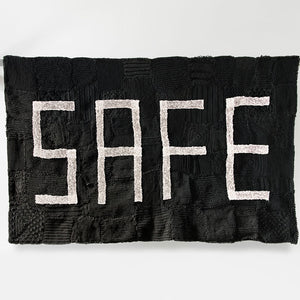Kate Just, HOPE & SAFE, 2014, Banners: Hand knitted builder’s line and retroreflective silver thread, viscose, cotton, aluminium, steel, paint, 280 x 125 x 25 cm