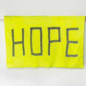 Kate Just, HOPE & SAFE, 2014, Banners: Hand knitted builder’s line and retroreflective silver thread, viscose, cotton, aluminium, steel, paint, 280 x 125 x 25 cm