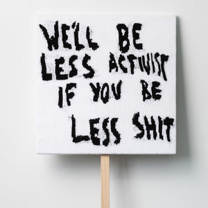   Kate Just, We’ll Be Less Activist If You Be Less Shit, 2021, knitted wool as placard with plywood stand, 64 x 64 cm