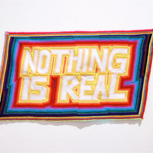 Paul Yore, Nothing is Real, 2013, wool needlepoint, 47 x 65 cm irreg