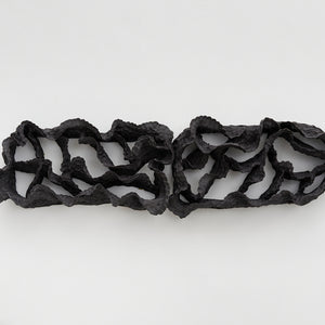 Sam Gold, Echoes between them, 2022, black stoneware, 29 x 99 x 12 cm irreg.